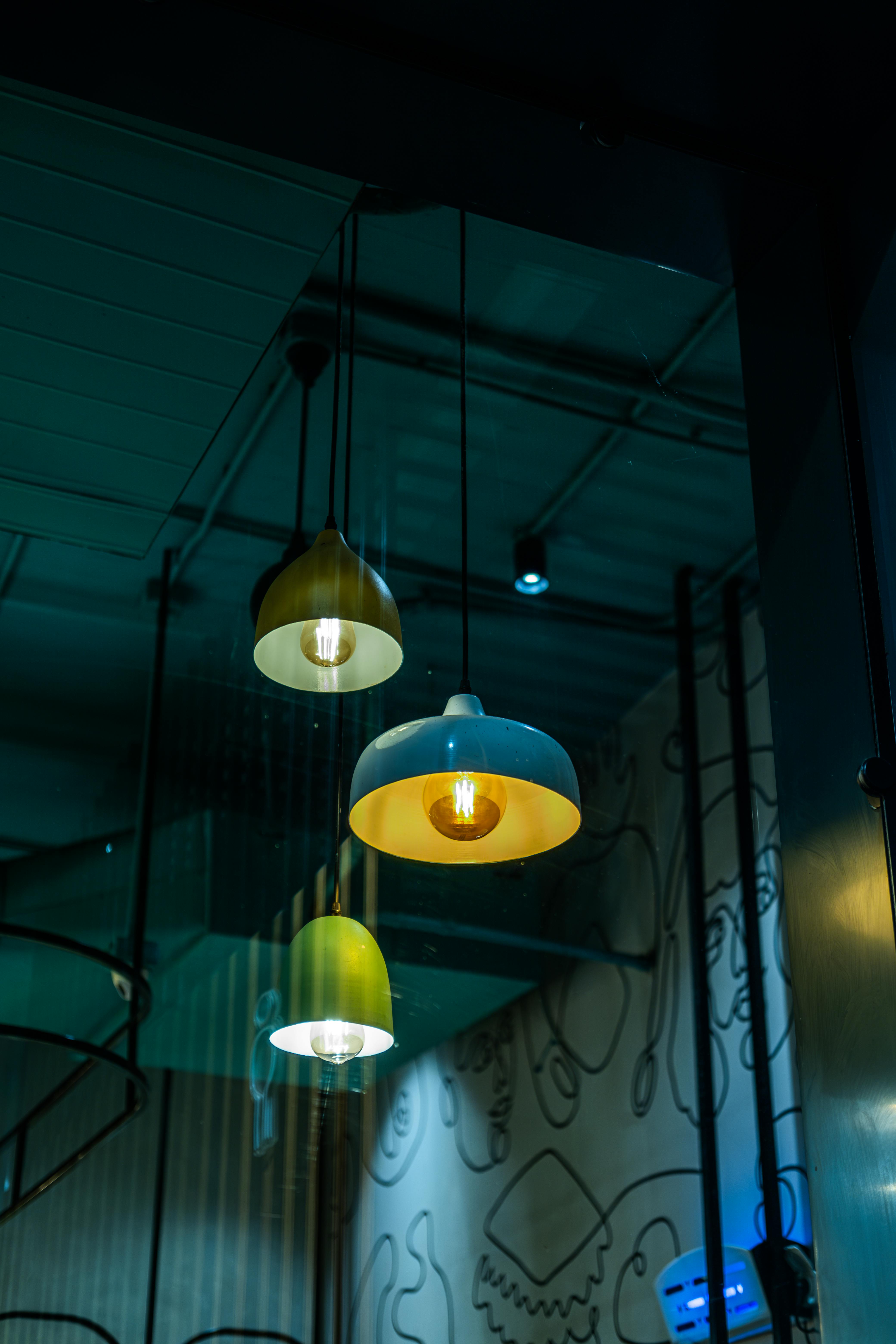 Warm pendant lighting inside a Tidal studio