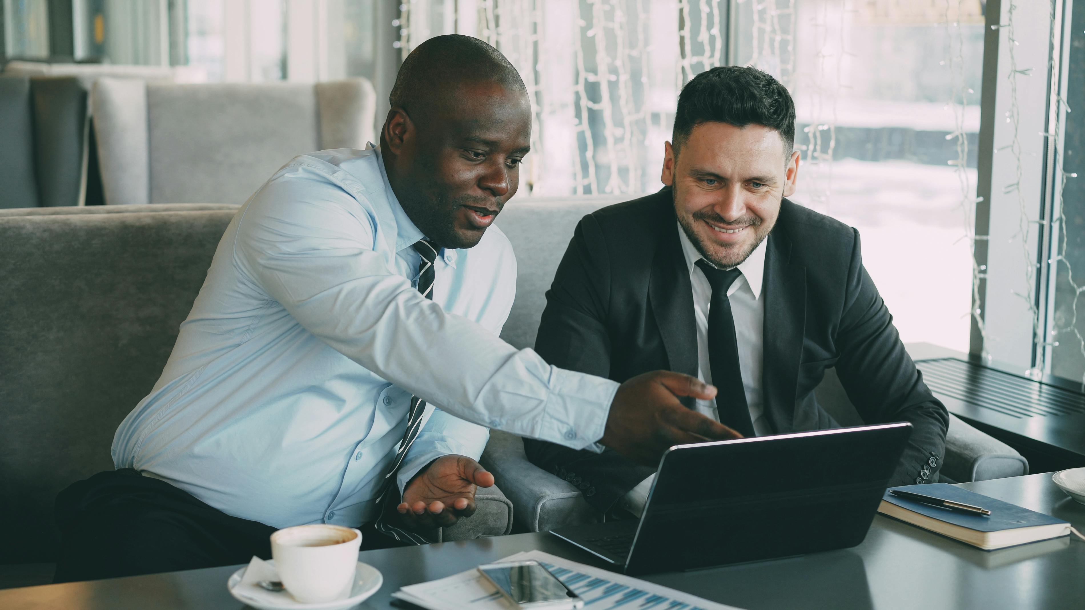Two Tidal partners reviewing work together
